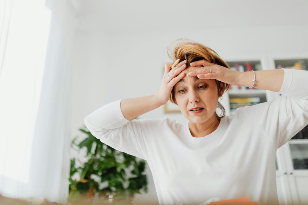 woman having hot flash during the day